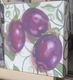 Eggplants on a Green and White Tablecloth