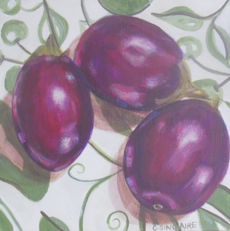 Eggplants on a Green and White Tablecloth